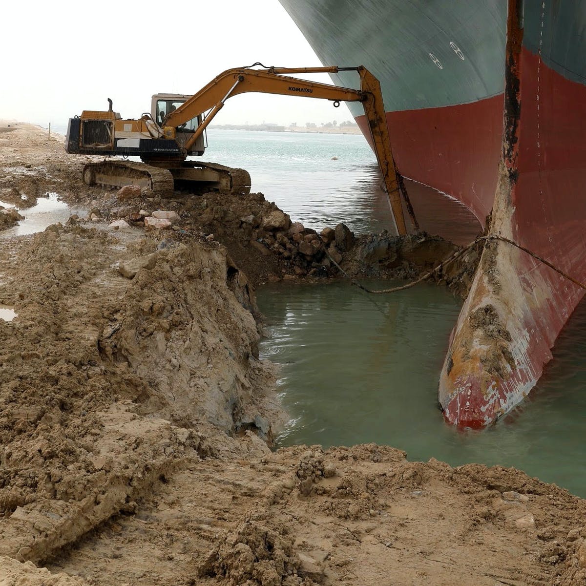 A tractor tries to free the Ever Given ship from the Suez Canal.