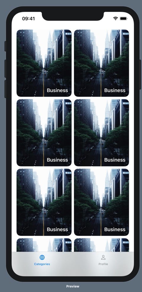 An iPhone 11 Pro max running our prototype. On the prototype is a bottom tab bar with two options: Categories and Profile. Above the categories tab label is a globe icon, and above the profile tab label is a person icon. The categories tab is blue and the profile tab is black. Above the bottom tab bar, there are six identical images of a foggy New York City taken from above a road, looking down it. There are deep green trees on either side of the road. The images are rectangular, with more height than width, and they are arranged in two columns and three rows. The image has rounded corners and, overlayed in the bottom right corner is the text "Business" in white.