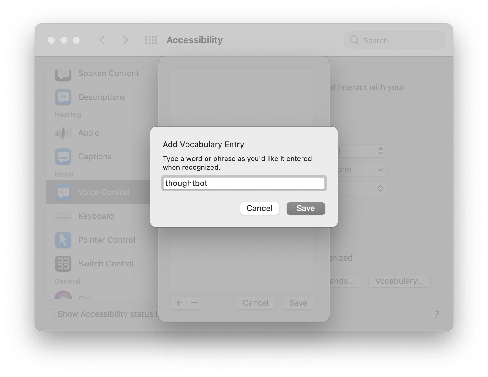 A modal hovering over the Voice Control preference pane titled, 'Add Vocabulary Entry,' with instructions that read, 'Type a word or phrase as you'd like it entered when recognized.' There is a text field with the word 'thoughtbot' entered into it. Screenshot.