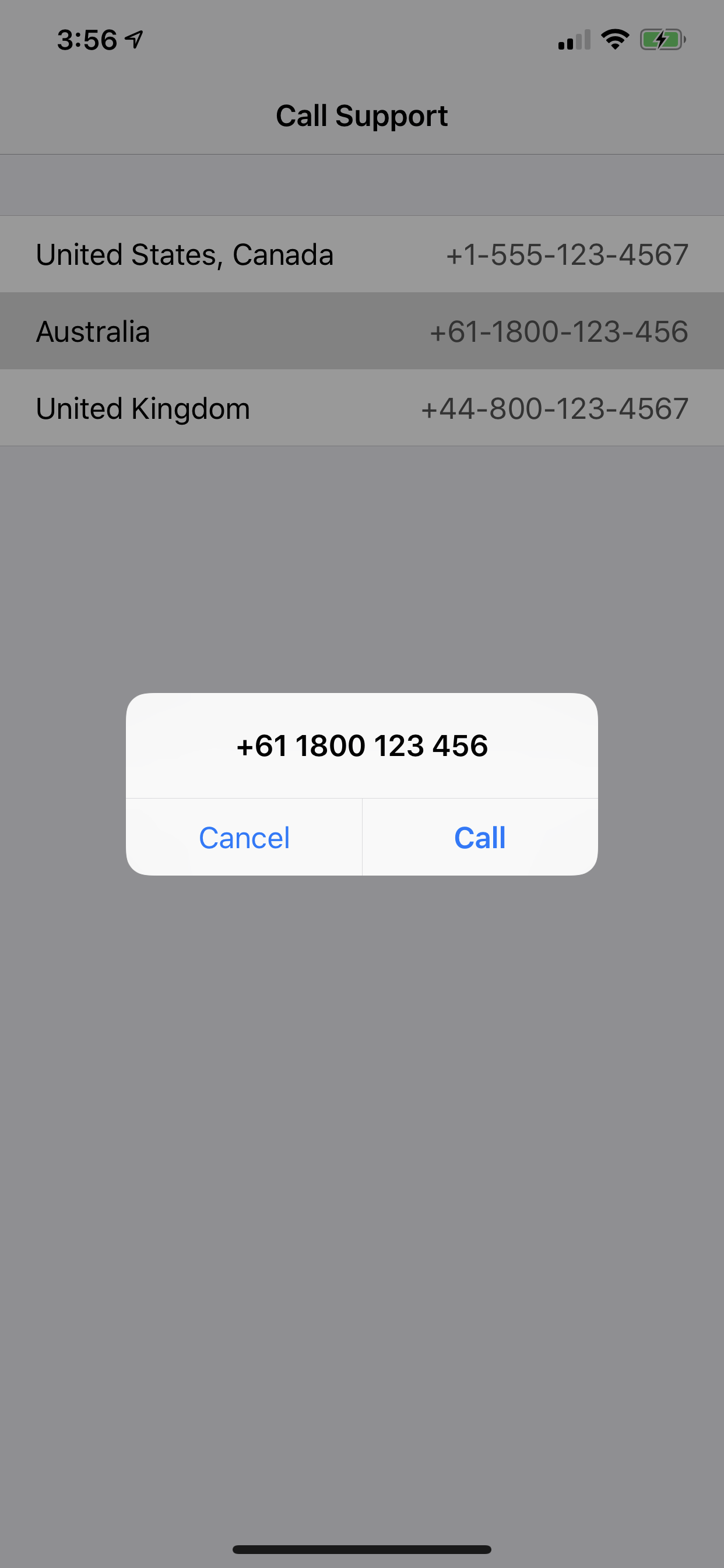 An alert showing the tapped phone number with a prompt to either Call or
  Cancel